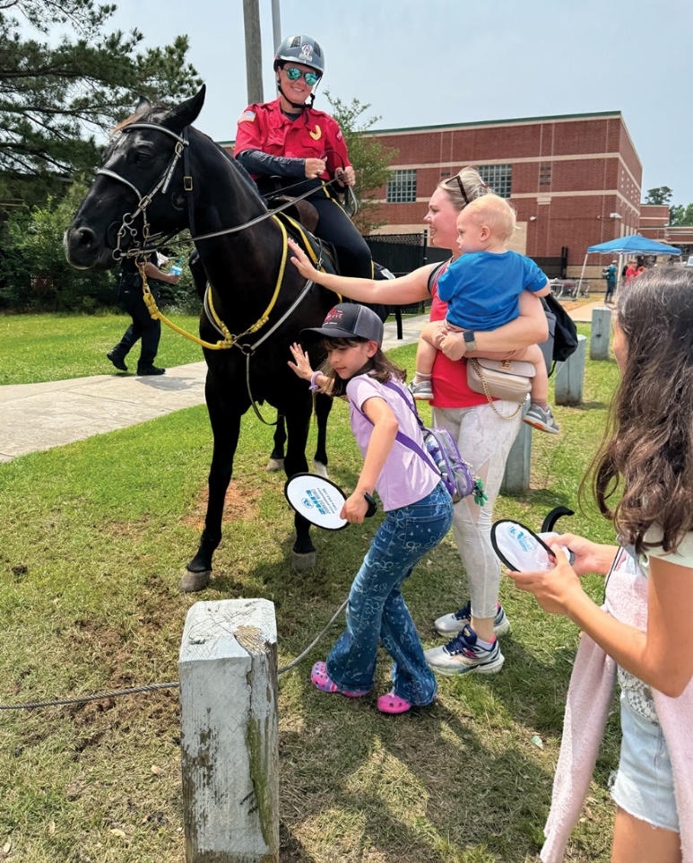 Children visiting an A&O mounted Trooper and patrol horse