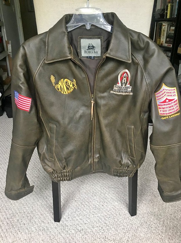 Custom leather bomber jacket with A&O, Phish, and American flag patches