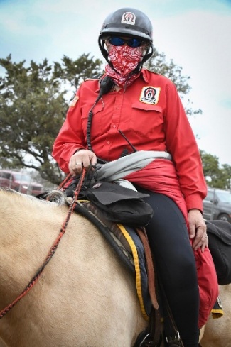 An A&O mounted Trooper wears protective face covering at the Texas Eclipse Festival